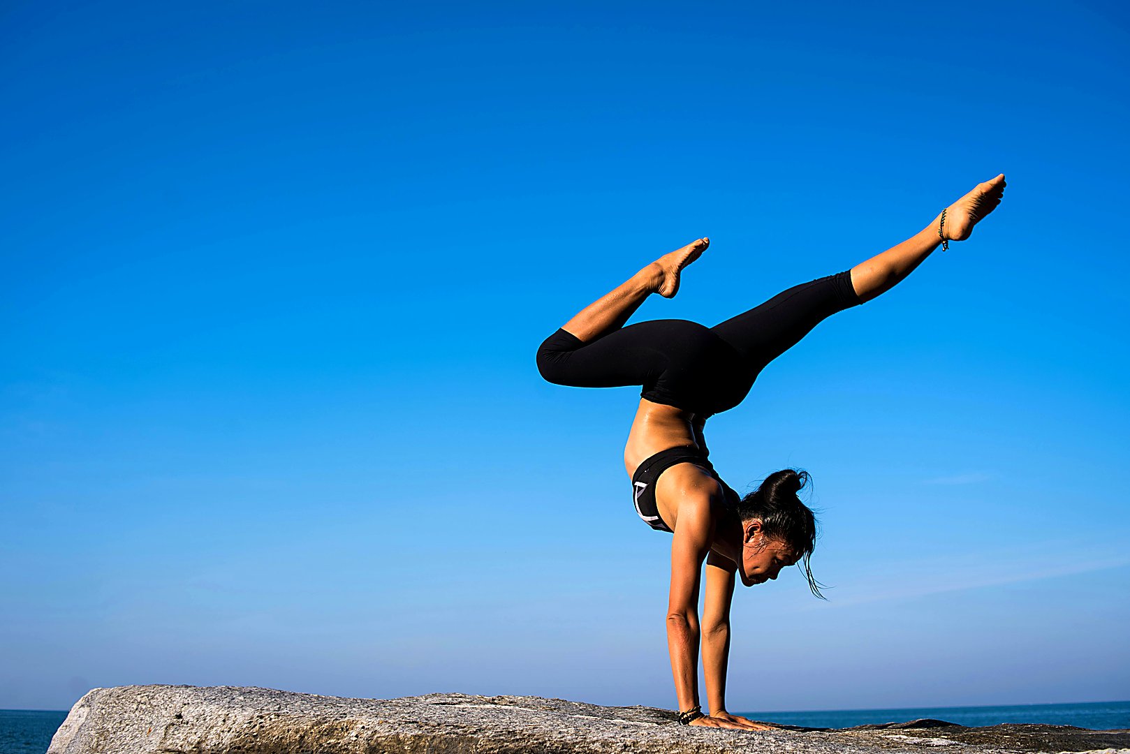 Serene yoga practice at Jucopea - a person in meditation pose surrounded by natural light